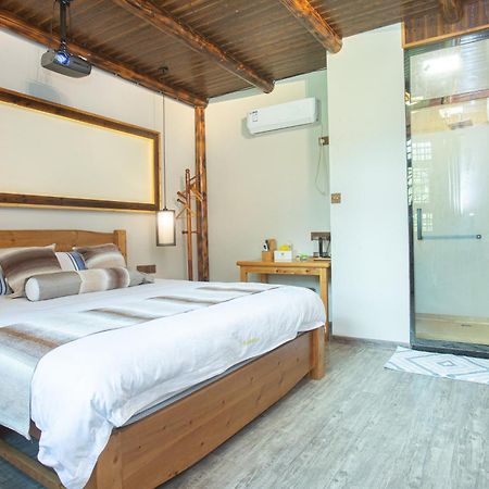 Nanjing Tulou Xinyuan HomeStay Luaran gambar