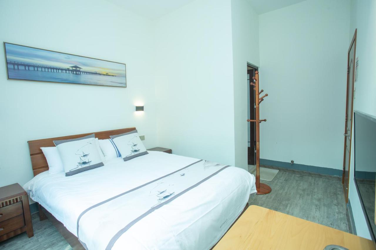 Nanjing Tulou Xinyuan HomeStay Luaran gambar