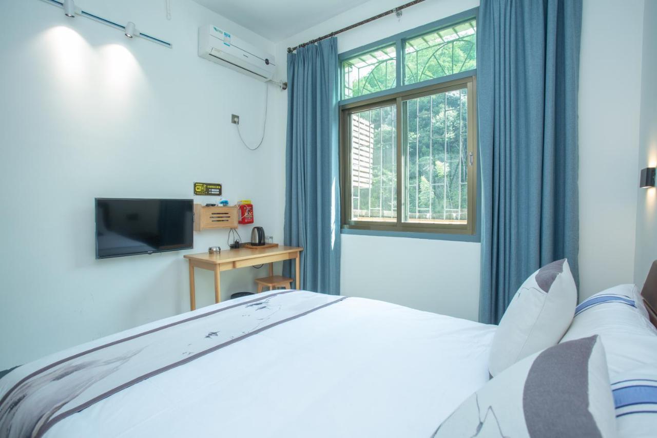Nanjing Tulou Xinyuan HomeStay Luaran gambar