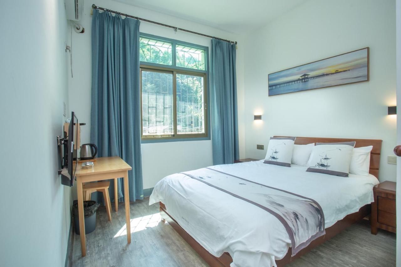 Nanjing Tulou Xinyuan HomeStay Luaran gambar